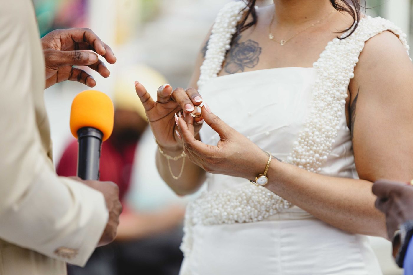 Groom reading his vows to his bride during an outdoor wedding ceremony