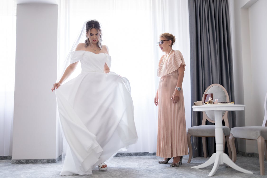 Mother and bride sharing a quiet moment together before the wedding ceremony