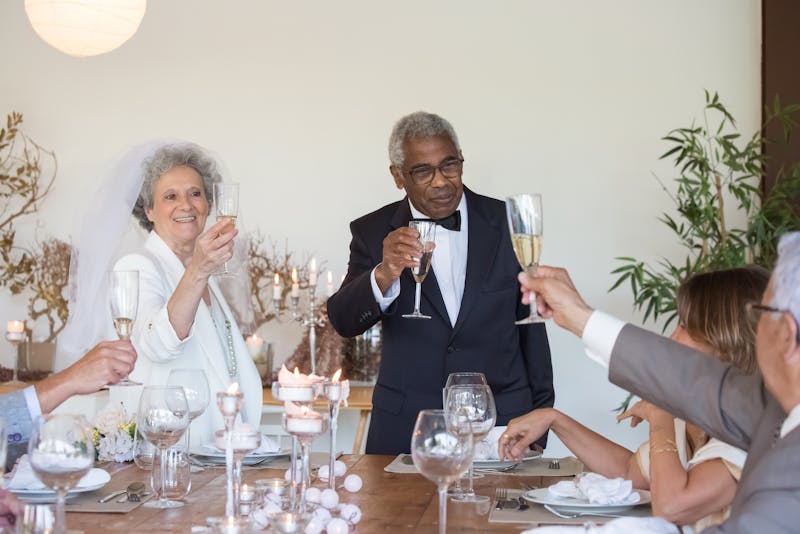 Wedding reception toast moment with mother of the bride holding a champagne glass