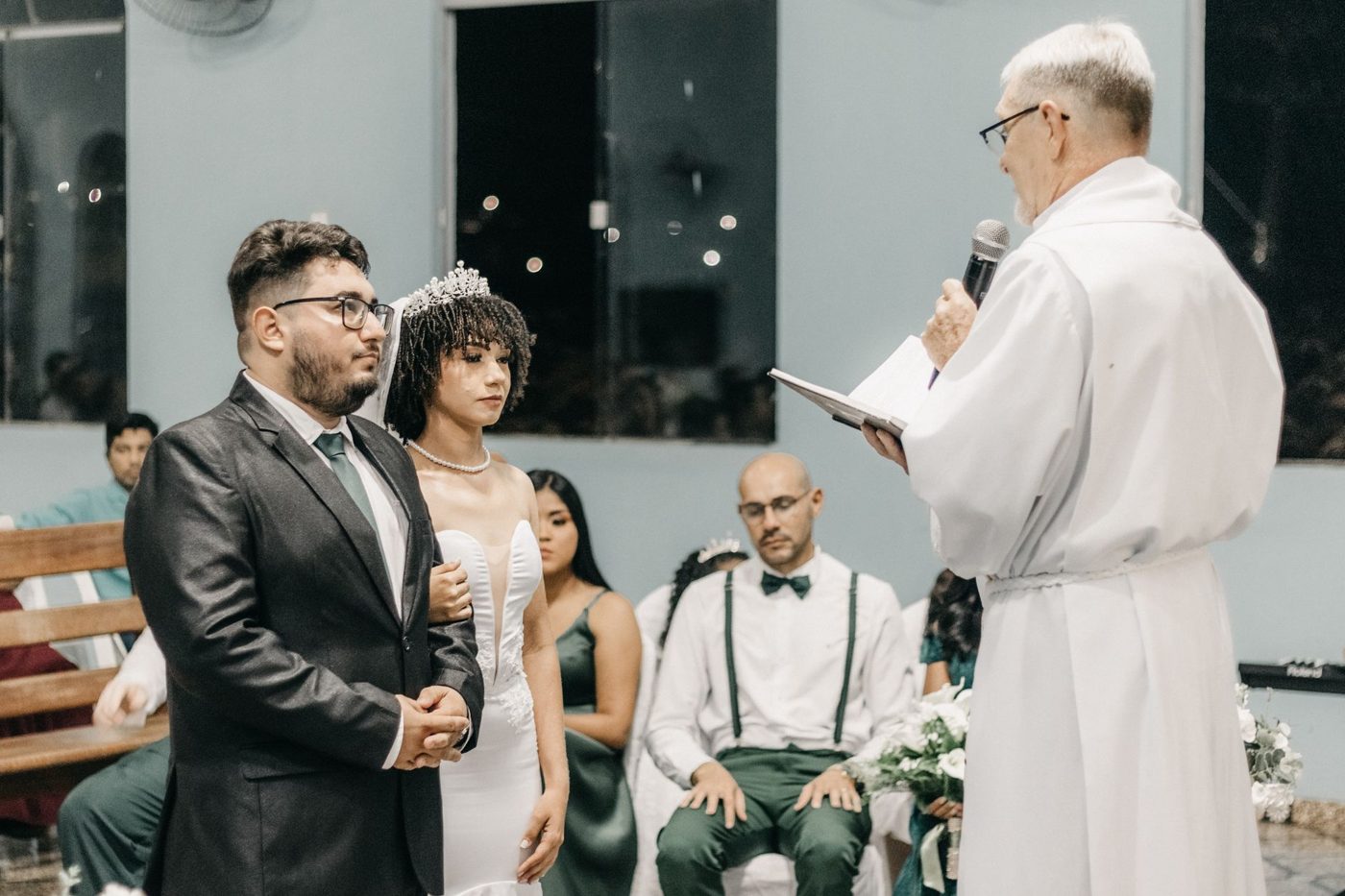 Officiant guiding a couple through their vows at a wedding ceremony