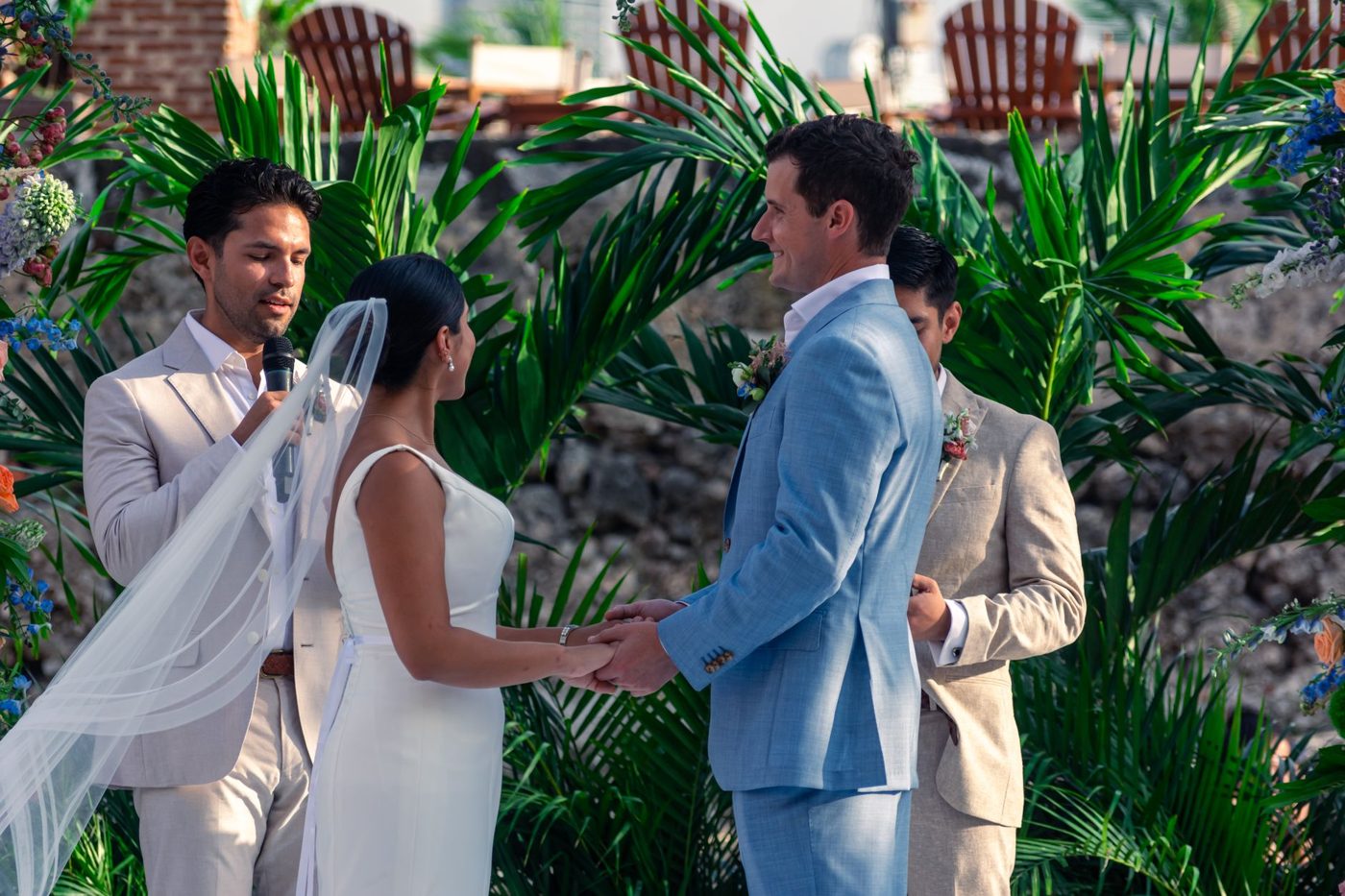 Officiant guiding a couple through their vows during a wedding ceremony
