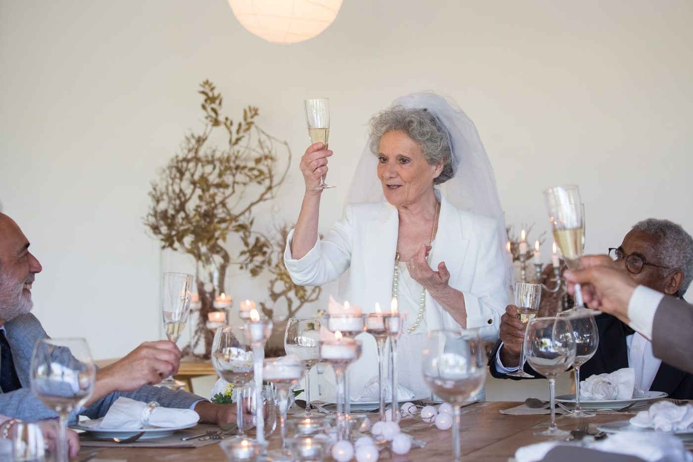 Groom giving a toast to guests at a wedding reception